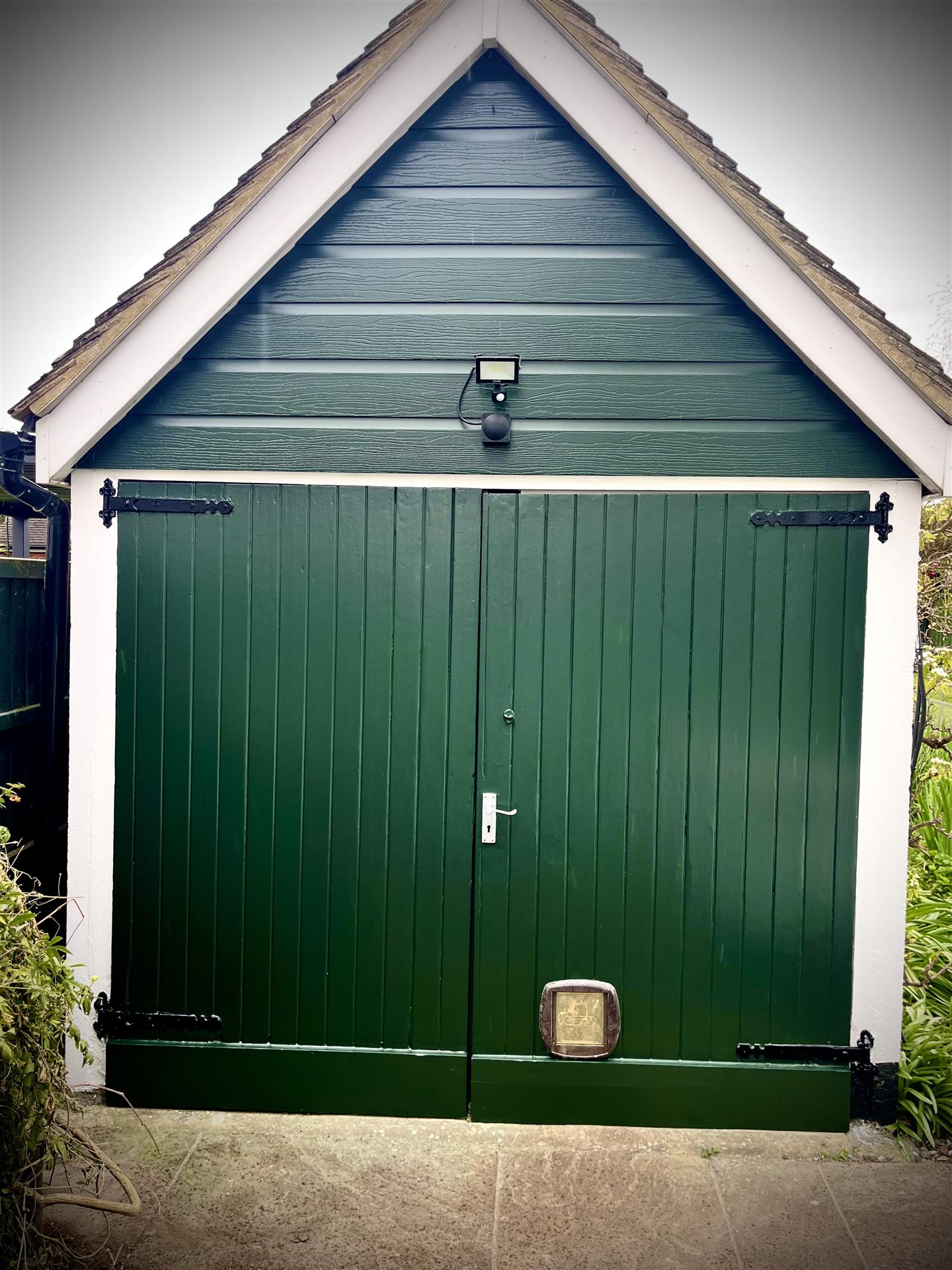 After, garage door painted dark green, Essex